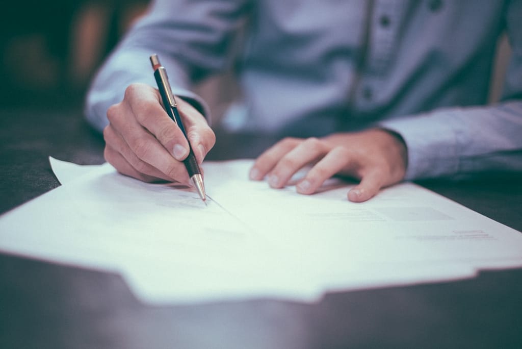hiring a qualified criminal defense attorney is not just an option—it’s a necessity. | Richard P. Davies, Esq. man writing on paper