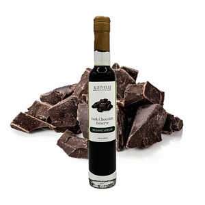 bottle of balsamic in front of dark chocolate chunks