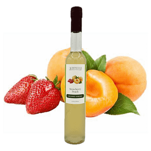 Strawberries and peaches behind a bottle of balsamic