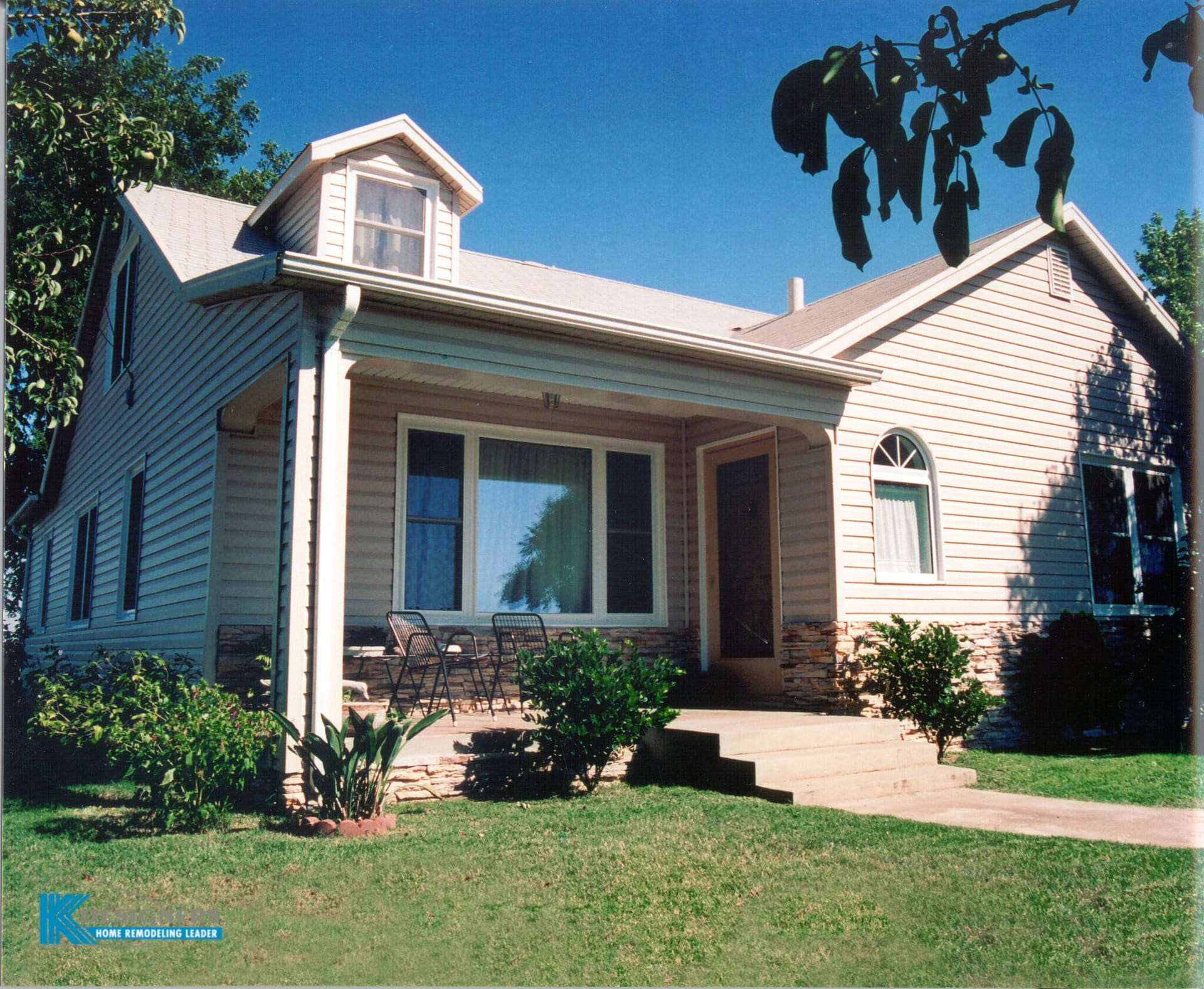 Photo of a home showing the remodeled siding and windows installed by K-Designers.